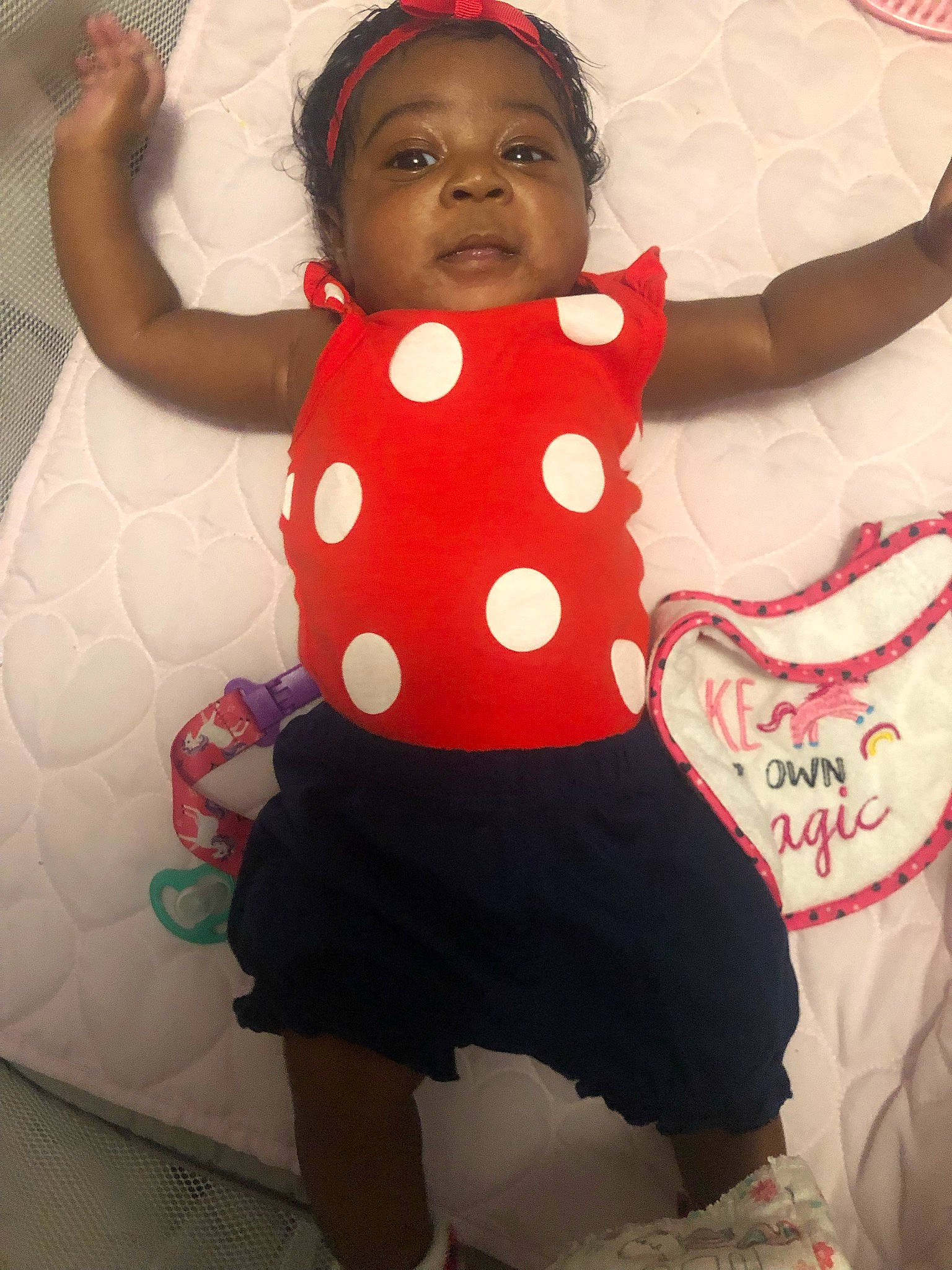 Kaisley joined the competition — help win amazing prizes! baby_toddler_clothing, black, entertainment, face, gesture, hairstyle, happy, headgear, human_body, joint, organ, pattern, person, pink, red, sleeve, smile, thigh, toddler, waist