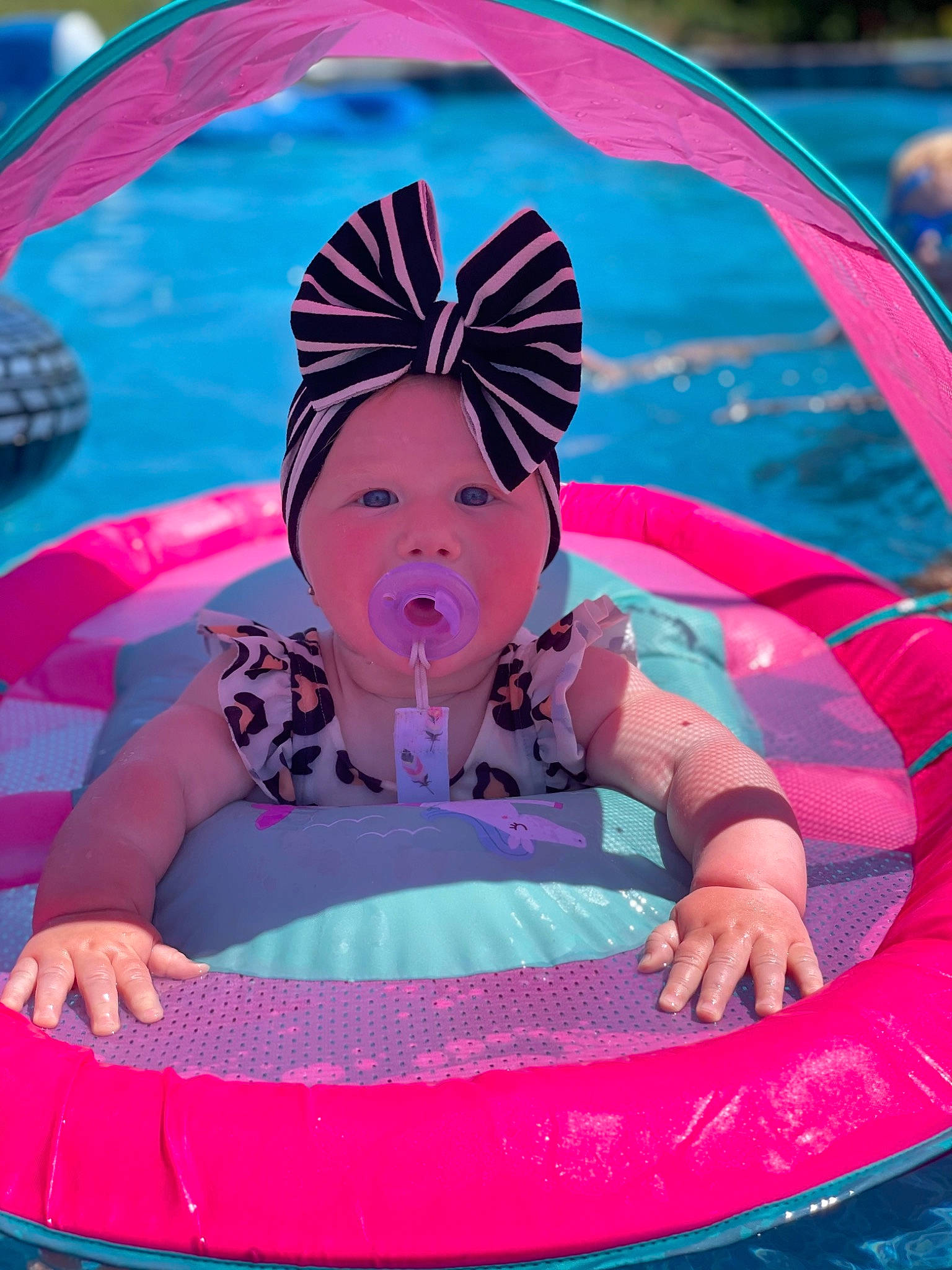 Tinsley joined the competition — help win amazing prizes! baby_products, blue, bumper, child, event, fashion_accessory, fun, games, grass, happy, headwear, inflatable, leisure, magenta, pattern, person, personal_protective_equipment, pink, purple, recreation