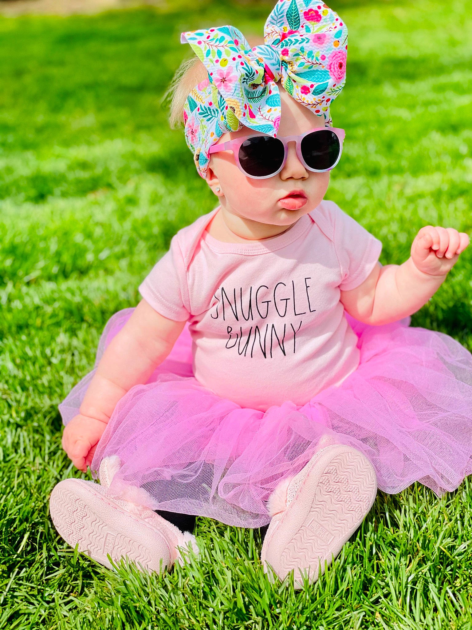 Tinsley is registered to the contest to win money with this photo: baby, baby_toddler_clothing, beauty, botany, dress, eyewear, fun, glasses, goggles, grass, green, happy, lawn, magenta, people_in_nature, person, pink, plant, sunglasses, toddler