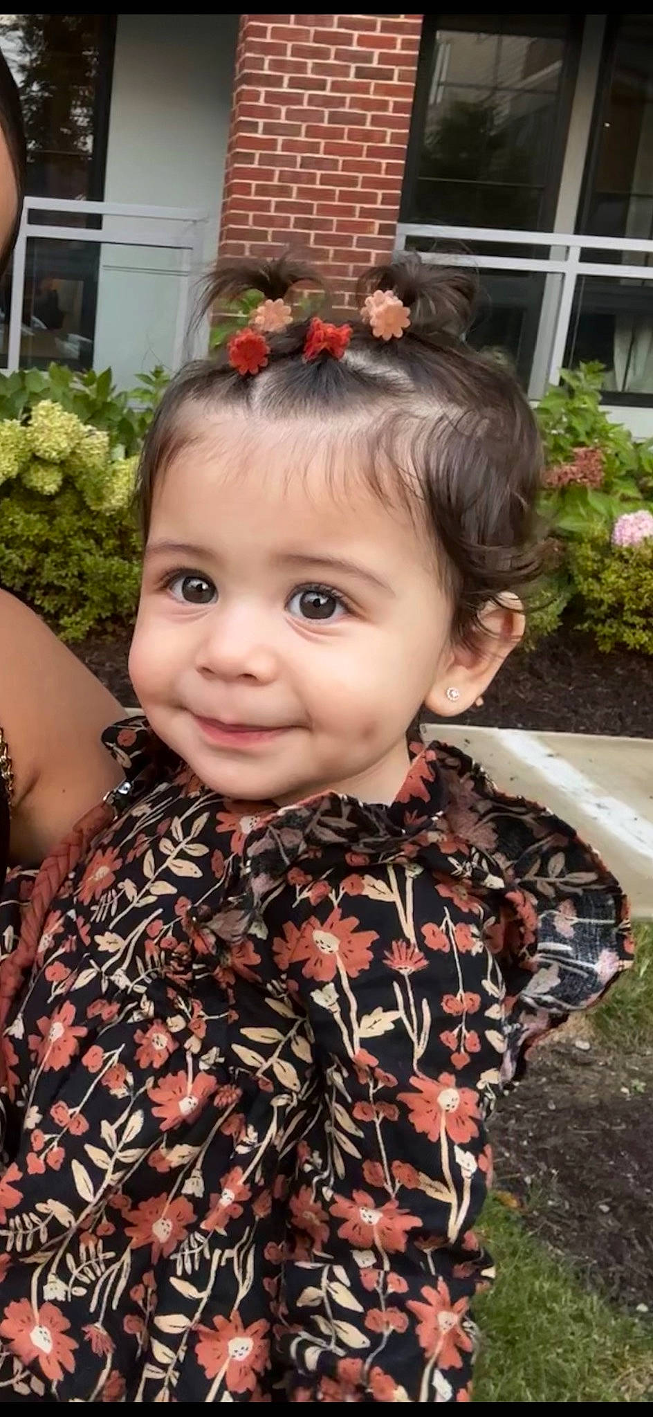 Brailey is registered to the contest to win money with this photo: black_hair, botany, brown_hair, eye, eyelash, flower, grass, hair, happy, head, headgear, headpiece, iris, joy, leaf, long_hair, pattern, person, pink, plant
