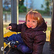 Ethan participe au concours pour gagner de l'argent avec cette photo : casual_clothing, child, cute, daytime, fun, happy, jacket, outdoor, park, person, play, play_equipment, playground, portrait, smiling, sneakers, sunlight, toddler, warm_clothes, young