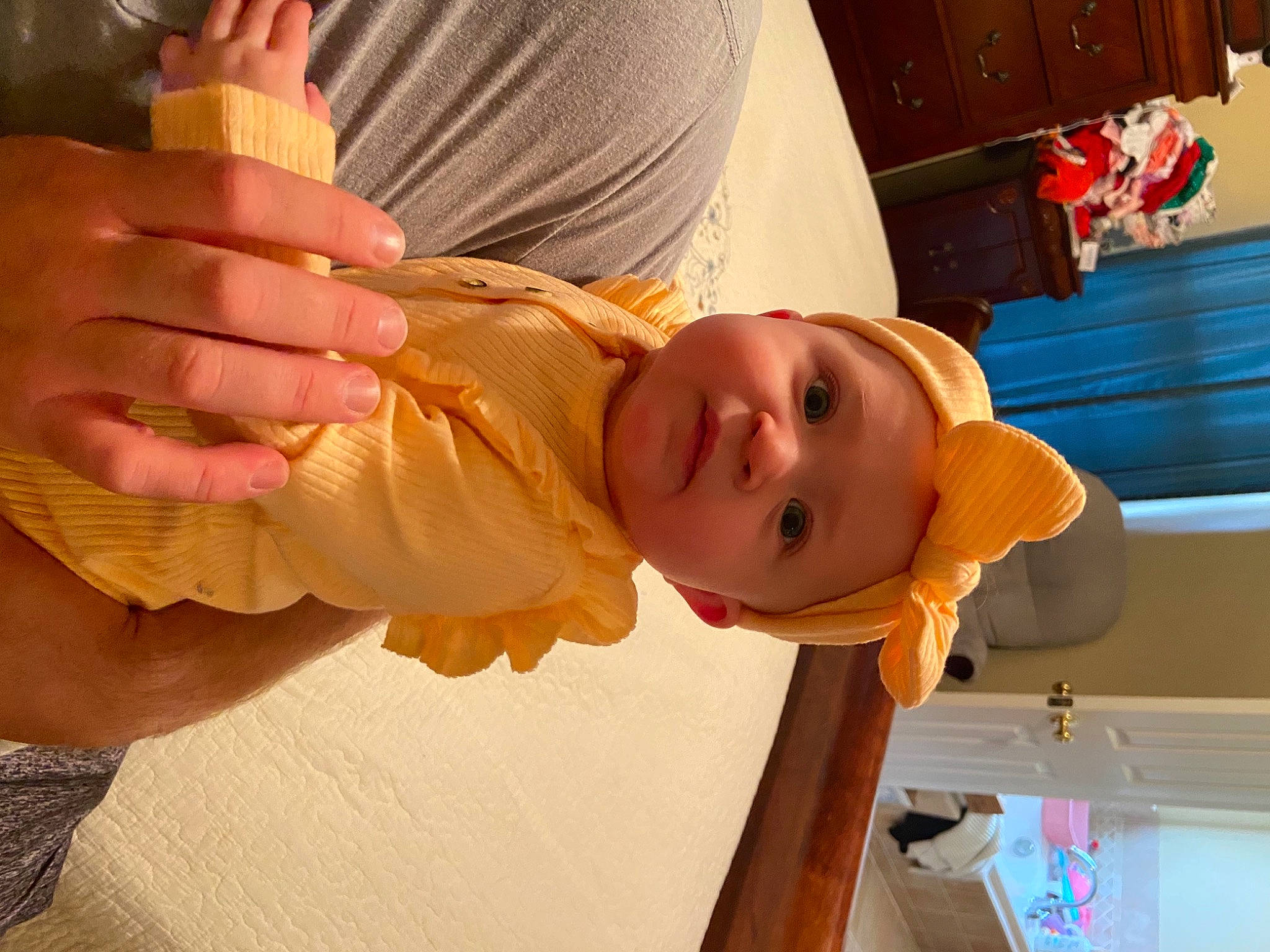 Savanna is registered to the contest to win money with this photo: abdomen, baby, baby_products, baby_toddler_clothing, chest, child, elbow, finger, fun, gesture, happy, hat, nail, orange, peach, person, room, sleeve, thumb, toddler