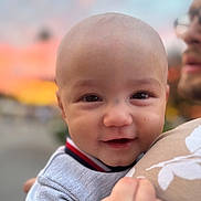 Ezekiel joined the competition — help win amazing prizes! baby, child, smiling, face, person, adult, holding, closeup, outdoor, sunset, sky, happy, portrait, head, clothing, hand, toddler, cute, warm, blurred_background
