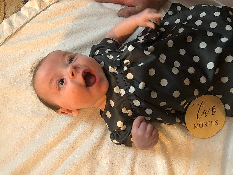 Madeleine is registered to the contest to win money with this photo: baby, baby_products, baby_safety, baby_toddler_clothing, child, circle, collar, comfort, day_dress, flooring, happy, linens, nail, one_piece_garment, pattern, person, polka_dot, sleeve, surprise, toddler