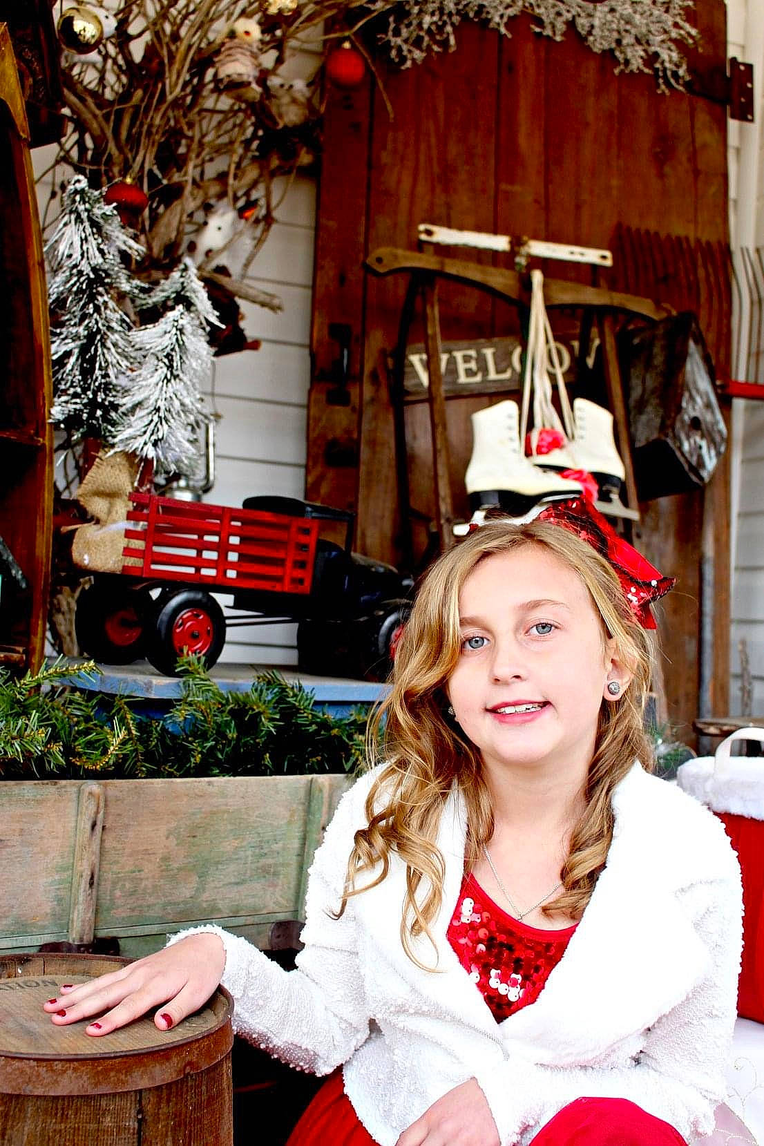 Rilynn is registered to the contest to win money with this photo: christmas, christmas_decoration, christmas_eve, christmas_ornament, event, happy, holiday, house, joy, leisure, person, photograph, plant, red, santa_claus, smile, snapshot, textile, tire, wheel