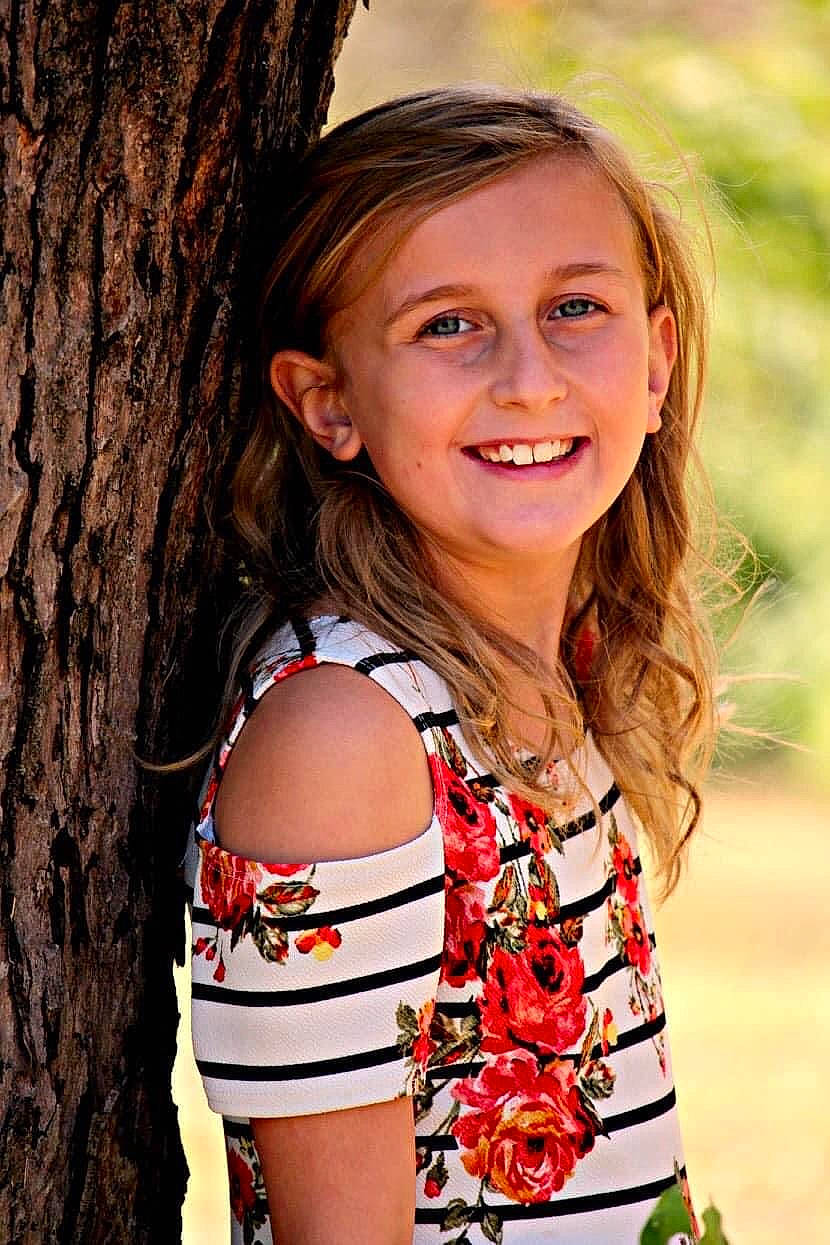 Rilynn joined the competition — help win amazing prizes! chin, clothing, eye, face, flash_photography, hair, happy, head, iris, joy, leaf, lip, organ, people_in_nature, person, red, shoulder, skin, smile, tree