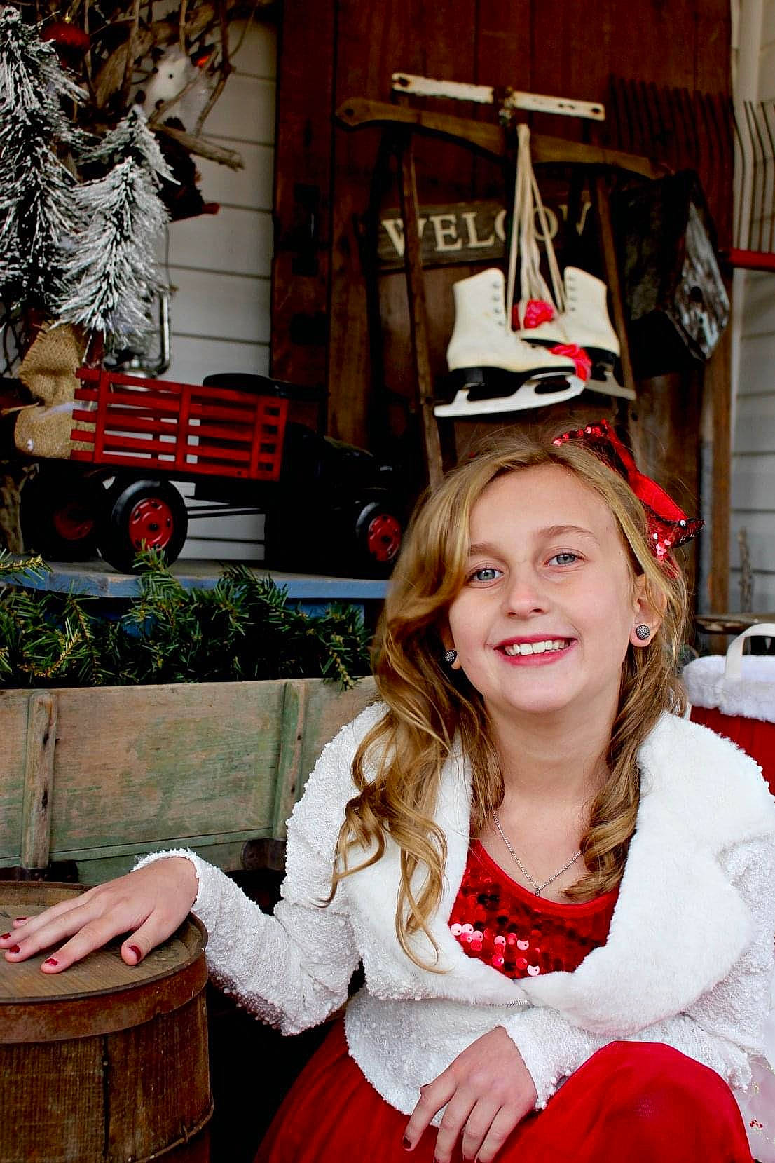 Rilynn joined the competition — help win amazing prizes! christmas, christmas_eve, costume_hat, event, fur, happy, hat, headgear, holiday, joy, motor_vehicle, person, red, santa_claus, smile, snapshot, textile, tire, wheel, white