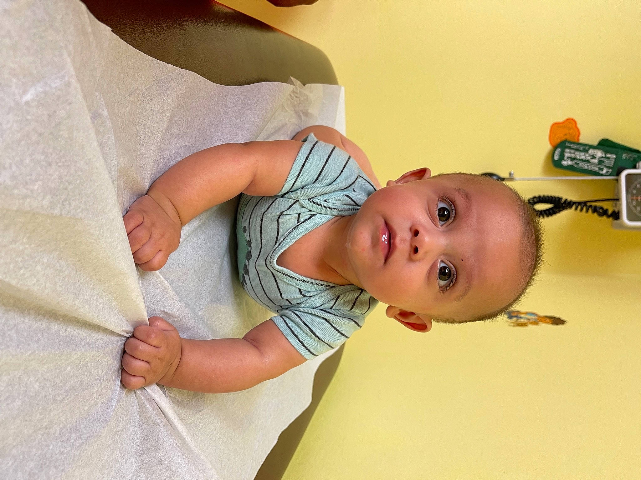 Judah is registered to the contest to win money with this photo: arm, baby, baby_products, baby_safety, baby_toddler_clothing, child, comfort, elbow, eye, finger, happy, joint, linens, neck, pattern, person, product, room, skin, sleeve