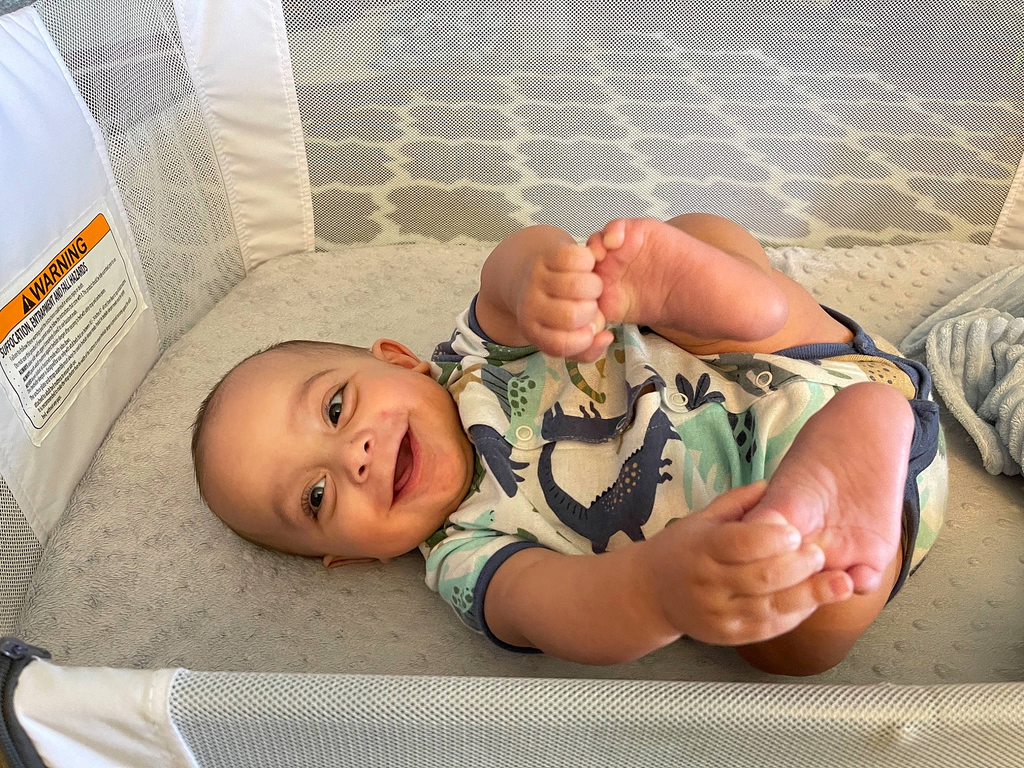 Judah joined the competition — help win amazing prizes! arm, baby, baby_laughing, baby_safety, baby_toddler_clothing, cheek, child, comfort, finger, foot, gesture, hand, joy, linens, mouth, person, product, skin, sleeve, smile