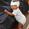 Douglas joined the competition — help win amazing prizes! toddler, child, helmet, smile, standing, white_clothing, couch, black_fabric, wood_floor, carpet, pillow, baby, indoors, person, furniture, playful, cute, home, happy, protective_gear