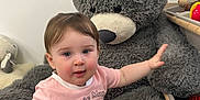 Eleanor joined the competition — help win amazing prizes! carpet, casual_clothing, child, cute, floor, gray, happy, indoor, minnie_mouse, pink_shirt, playroom, plush_toy, reaching, sitting, soft, stuffed_animal, teddy_bear, toddler, toy_storage, young_child