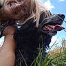 blonde_hair, canine, casual, clouds, dog, field, friendship, glasses, grass, happy, joy, nature, outdoor, pet, portrait, sky, smile, summer, tongue_out, woman