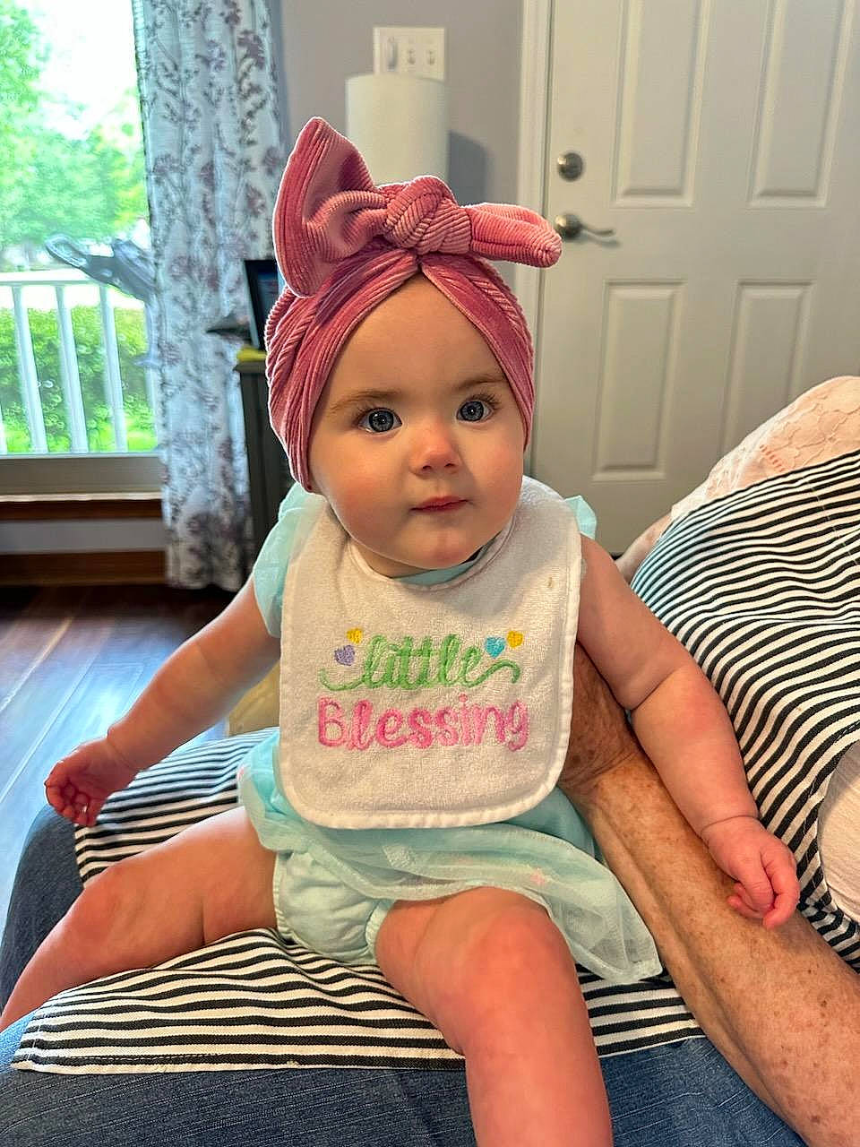 Ainsley is registered to the contest to win money with this photo: baby, baby_toddler_clothing, cap, cheek, child, chin, comfort, cool, door, face, fun, happy, head, headgear, headwear, leg, person, pink, skin, t_shirt