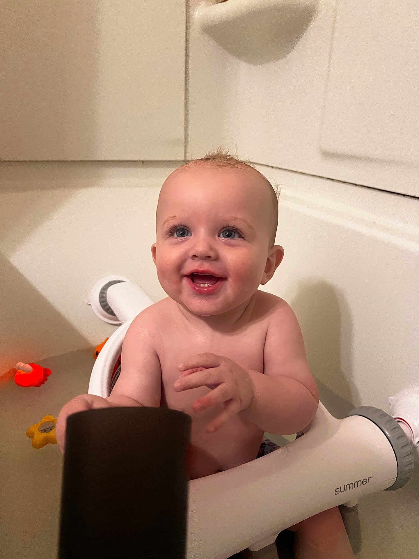 Braxton joined the competition — help win amazing prizes! baby, bathtub, bath_seat, bath_toys, child, smiling, water, indoor, skin, happy, sitting, person, cute, young_child, plumbing, white, blue_eyes, toy, bathroom, summer