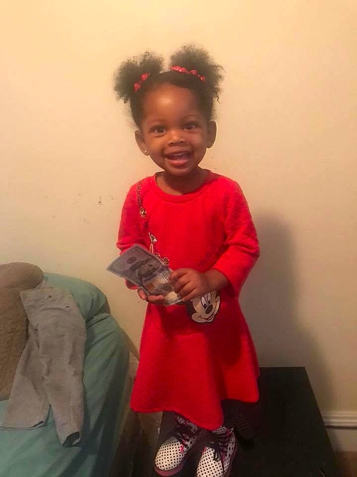 Janaya is registered to the contest to win money with this photo: arm, child, costume, day, girl, hair, hair_coloring, hairstyle, human_hair_color, joint, joy, outerwear, person, pink, red, shoulder, skin, smile, standing, t_shirt