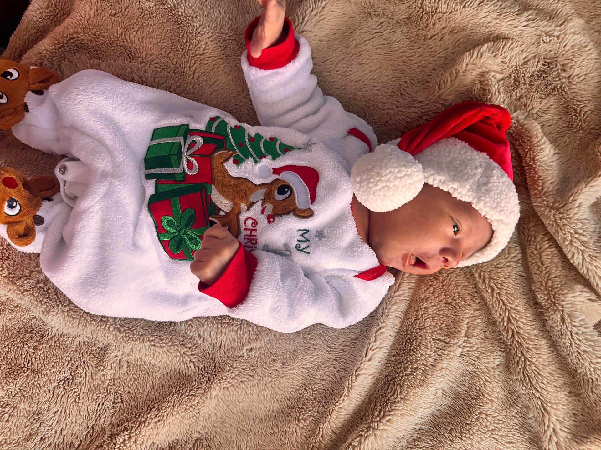Braylin joined the competition — help win amazing prizes! baby, christmas, holiday_clothing, santa_hat, reindeer_slippers, blanket, infant, cute, festive, warm, sleepwear, soft, portrait, lying_down, holiday, child, smiling, indoors, happy, cozy