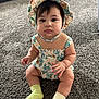 baby, child, sitting, hat, romper, carpet, indoor, cute, sock, mismatched_socks, curious, portrait, infant, chubby_cheeks, person, clothing, floor, closeup, young_child, headwear