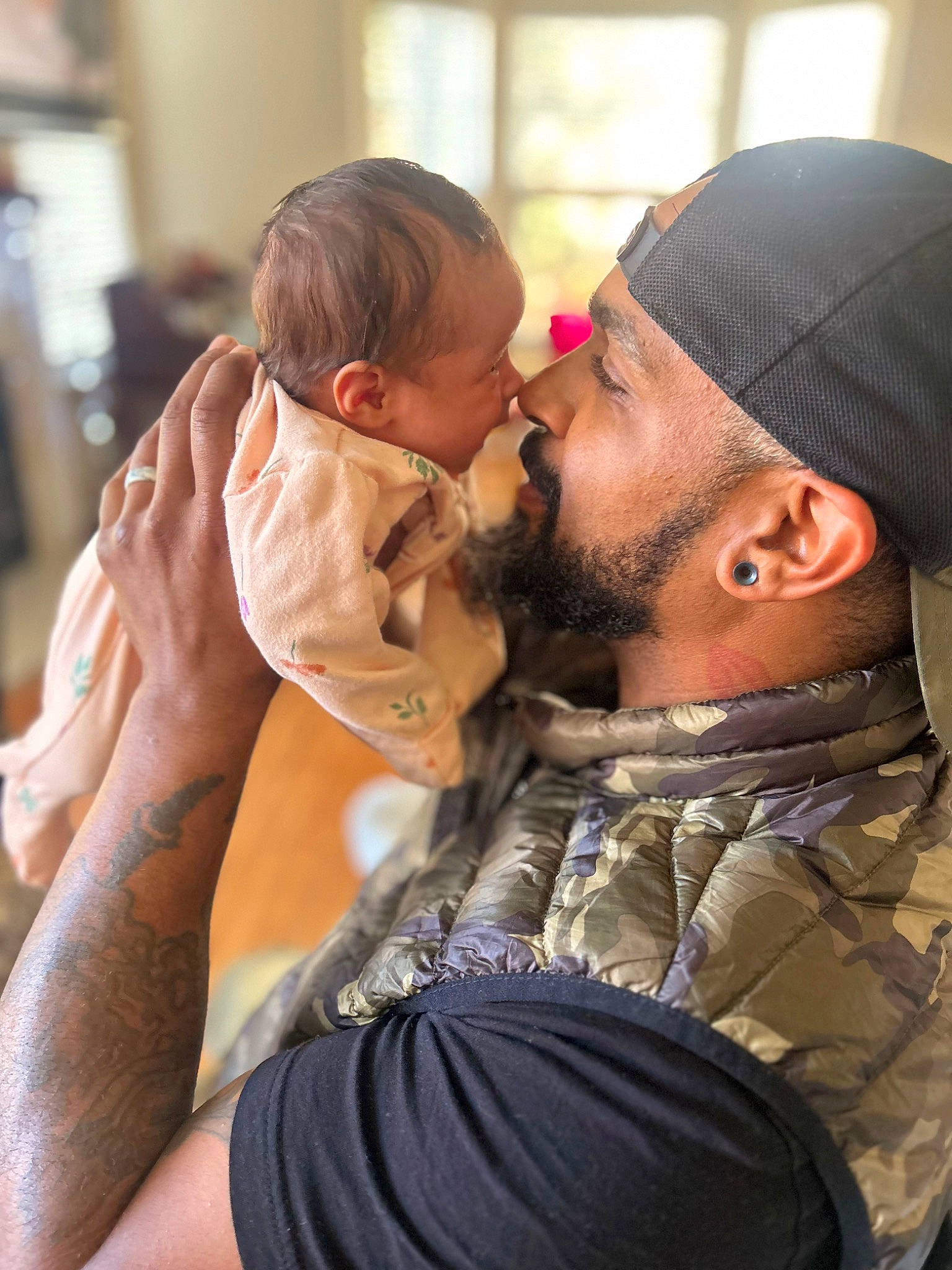 Lailah is registered to the contest to win money with this photo: baby, beard, cap, child, ear, event, eyewear, fashion_accessory, fun, gesture, hairstyle, happy, headwear, hug, interaction, jewellery, kiss, love, person, romance