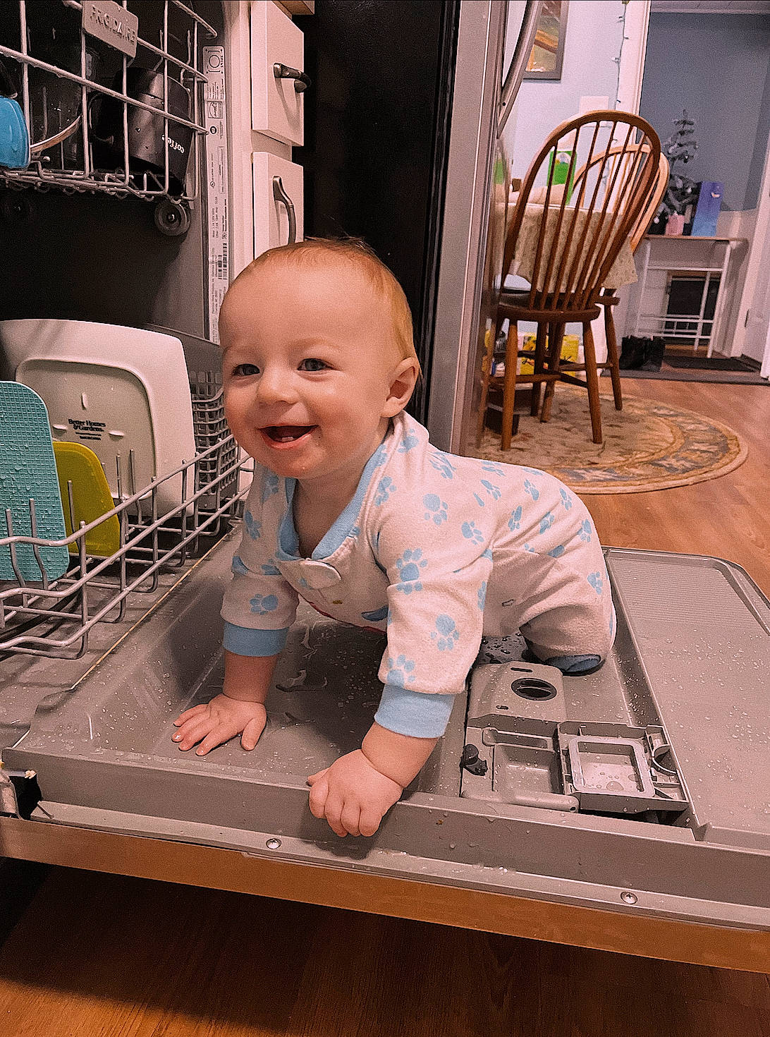Atticus joined the competition — help win amazing prizes! baby, baby_products, baby_safety, baby_toddler_clothing, chair, child, comfort, floor, flooring, foot, fun, hardwood, joy, person, product, room, sitting, smile, t_shirt, toddler