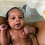 Khelani is registered to the contest to win money with this photo: baby, bath, water, rubber_duck, hand, skin, toddler, infant, wet, tub, cute, child, person, sitting, indoors, closeup, expression, face, parent, playful