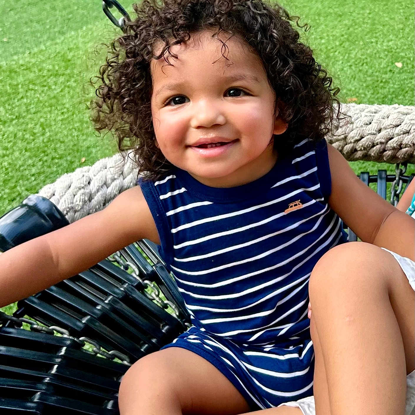 Zebec is registered to the contest to win money with this photo: child, curlyhair, face, female, furniture, girl, grass, hair, happy, head, nature, outdoors, park, person, photography, plant, playarea, portrait, sitting, summer