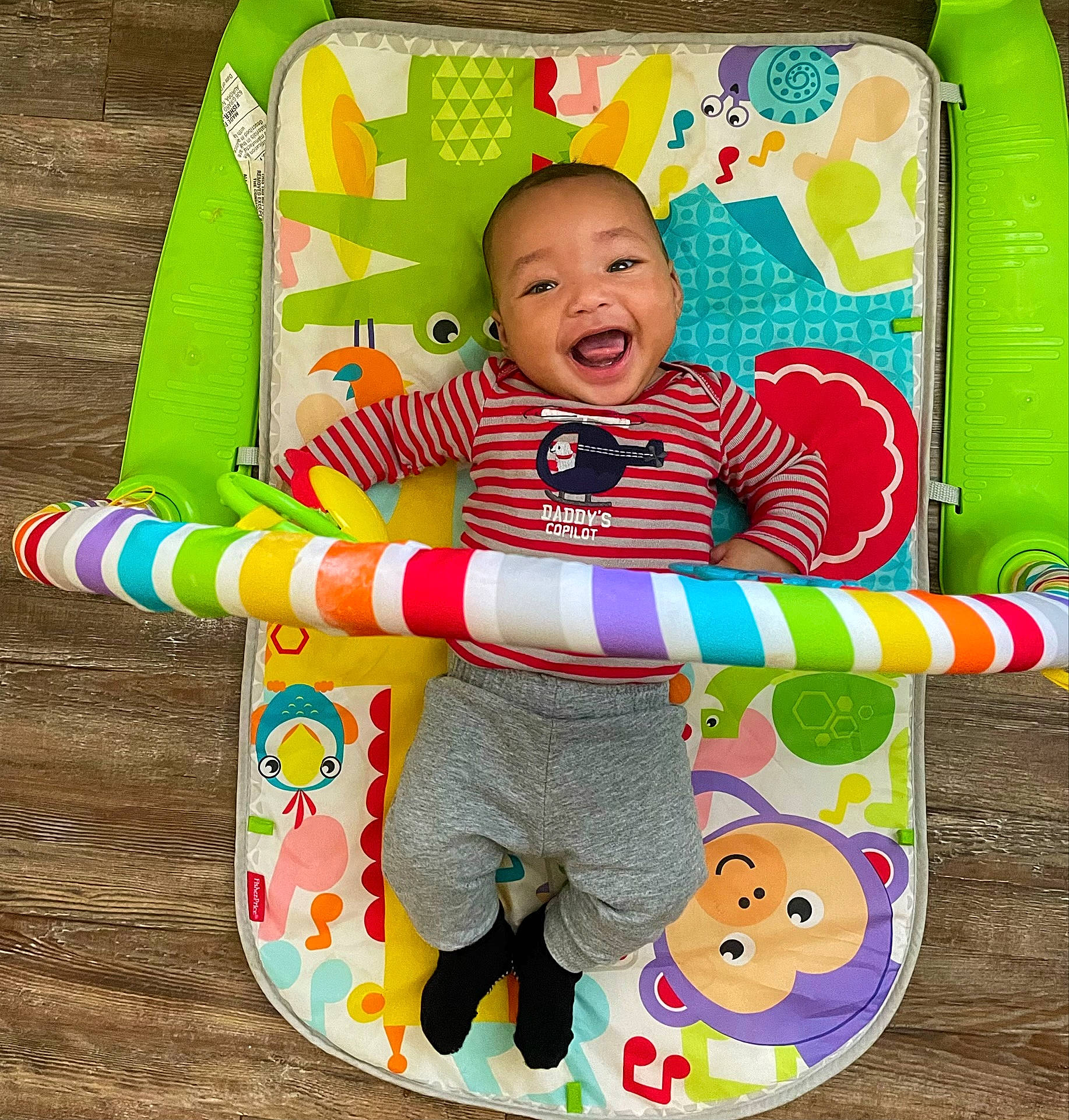Carmelo joined the competition — help win amazing prizes! baby, baby_products, baby_toddler_clothing, baby_toys, chair, child, green, happy, linens, pattern, person, pink, play, rectangle, sitting, sleeve, smile, t_shirt, textile, toddler