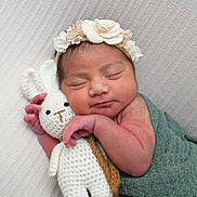 Emely joined the competition — help win amazing prizes! newborn, baby, sleeping, blanket, headband, flower, crocheted_bunny, toy, cuddle, peaceful, soft_texture, closeup, portrait, infant, resting, cute, hand, face, wrapped, cozy