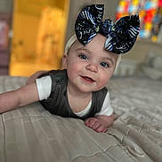 Raelynn joined the competition — help win amazing prizes! accessories, baby, bed, bedroom, clothing, couch, cushion, dress, face, furniture, happy, hat, head, homedecor, indoors, person, photography, portrait, room, smile