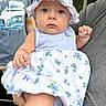 baby, child, infant, hat, blueberries, dress, striped_clothing, person, adult_hand, outdoor, nature, greenery, portrait, cute, serious_expression, holding, clothing, summer, headwear, skin