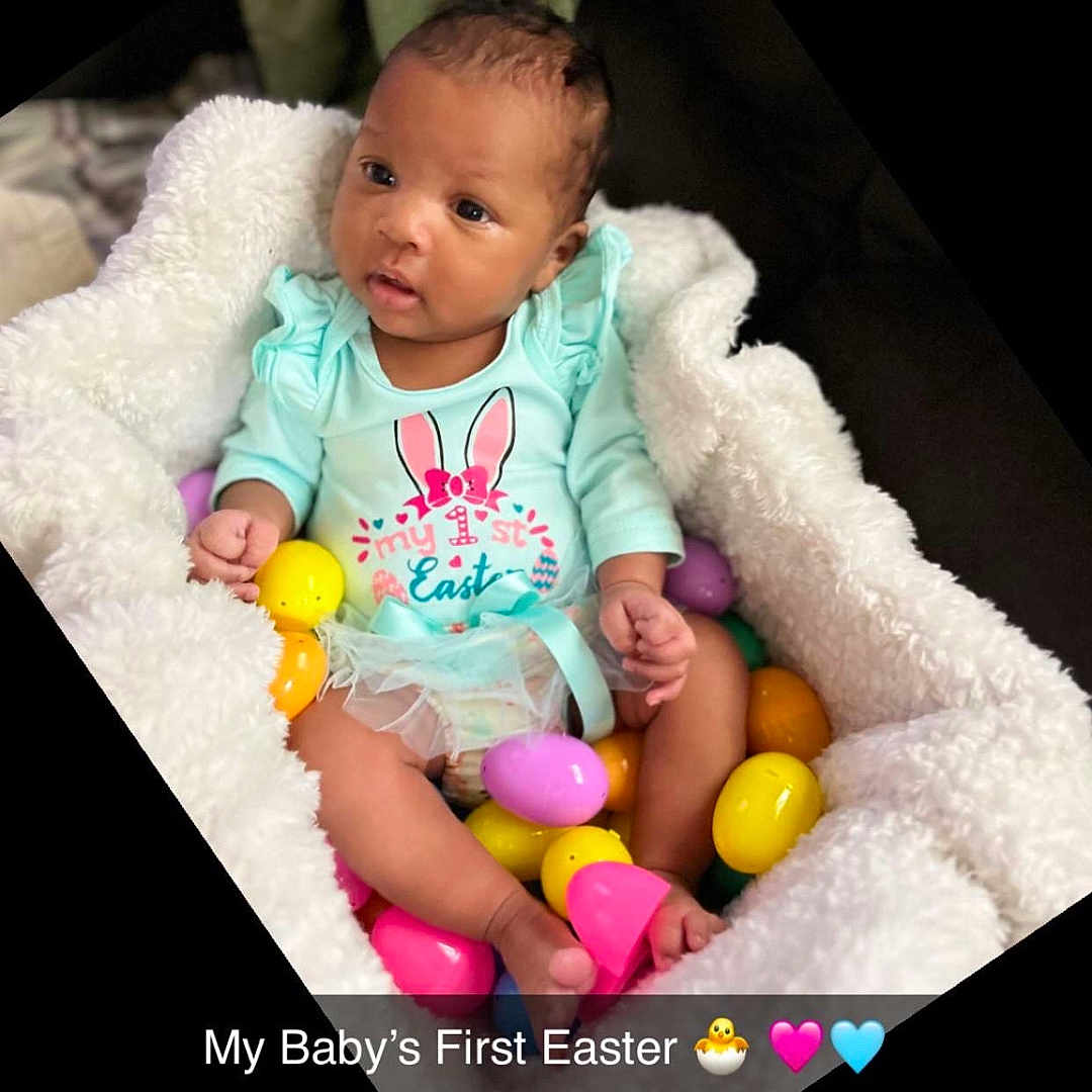 Naveah is registered to the contest to win money with this photo: baby, ball, bodypart, clothing, face, furniture, head, indoors, newborn, people, person, photography, portrait, quilt, sleeping, sport, t_shirt, tennis, tennisball, toy