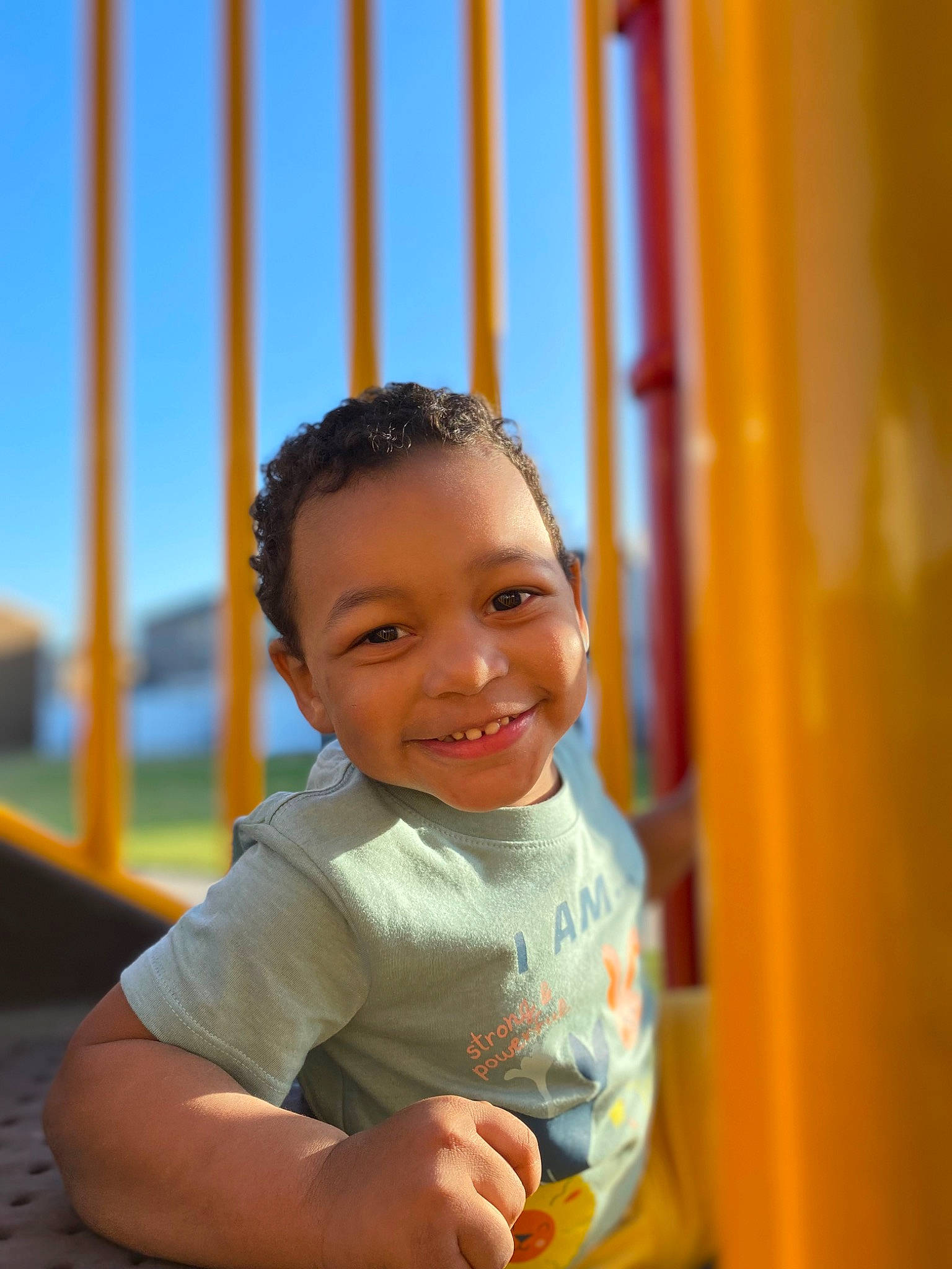 Nolan joined the competition — help win amazing prizes! azure, child, electric_blue, eye, flash_photography, fun, happy, joy, leisure, outdoor_play_equipment, person, playground, recreation, sitting, skin, sky, smile, summer, swing, t_shirt