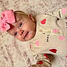 Kazelynn joined the competition — help win amazing prizes! adorable, baby, baby_girl, blue_eyes, child, closeup, clothing, cozy, cute, headband, hearts, infant, infant_fashion, love_text, lying_down, patterned_background, pink_bow, portrait, smiling, soft_surface