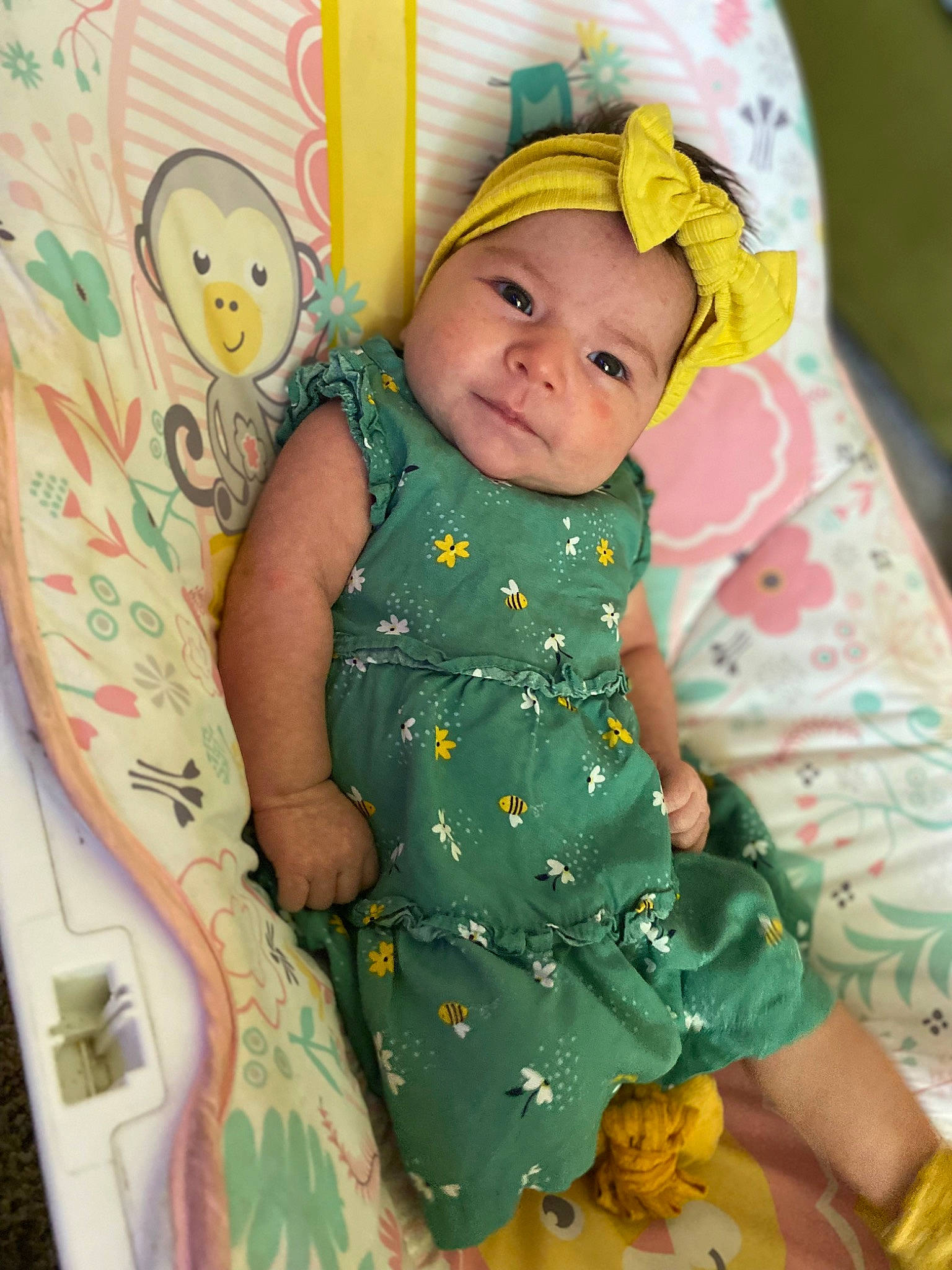 Amethyst is registered to the contest to win money with this photo: baby, baby_products, baby_toddler_clothing, cap, cheek, child, comfort, day_dress, dress, facial_expression, fun, happy, headwear, linens, pattern, person, pink, skin, sleeve, textile