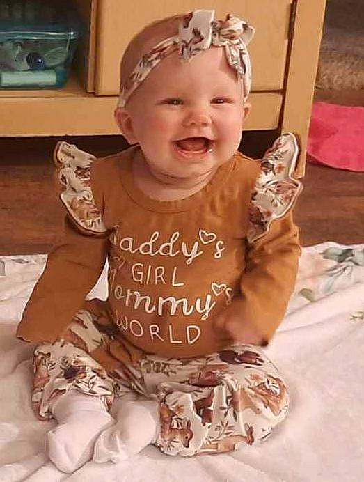Chevelle is registered to the contest to win money with this photo: baby, baby_toddler_clothing, cap, child, event, facial_expression, fashion_accessory, fun, hairstyle, happy, headpiece, headwear, jewellery, joy, kitchen_appliance, party_hat, party_supply, person, pink, skin