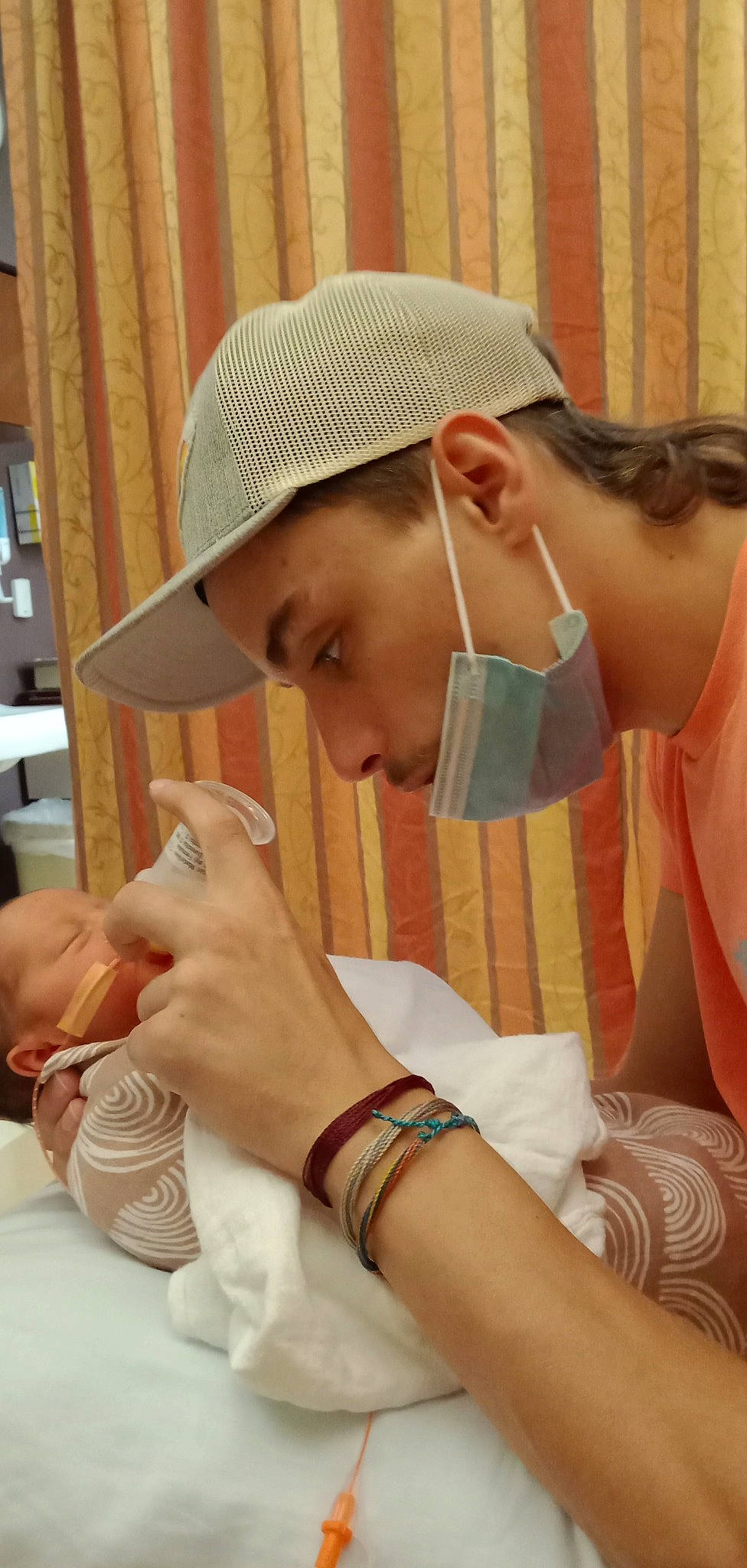 Josephine is registered to the contest to win money with this photo: arm, cap, child, elbow, eyelash, fashion_accessory, finger, gesture, hand, hat, headgear, headwear, jewellery, nail, neck, person, shelf, skin, sun_hat, tableware