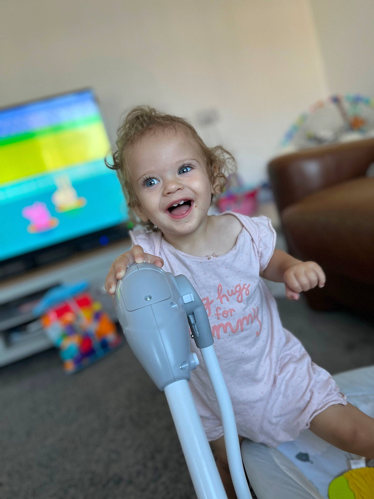 Maddison joined the competition — help win amazing prizes! baby, baby_playing_with_toys, baby_products, blond, child, couch, eye, fun, happy, leisure, person, play, recreation, room, sitting, skin, smile, t_shirt, toddler, toy
