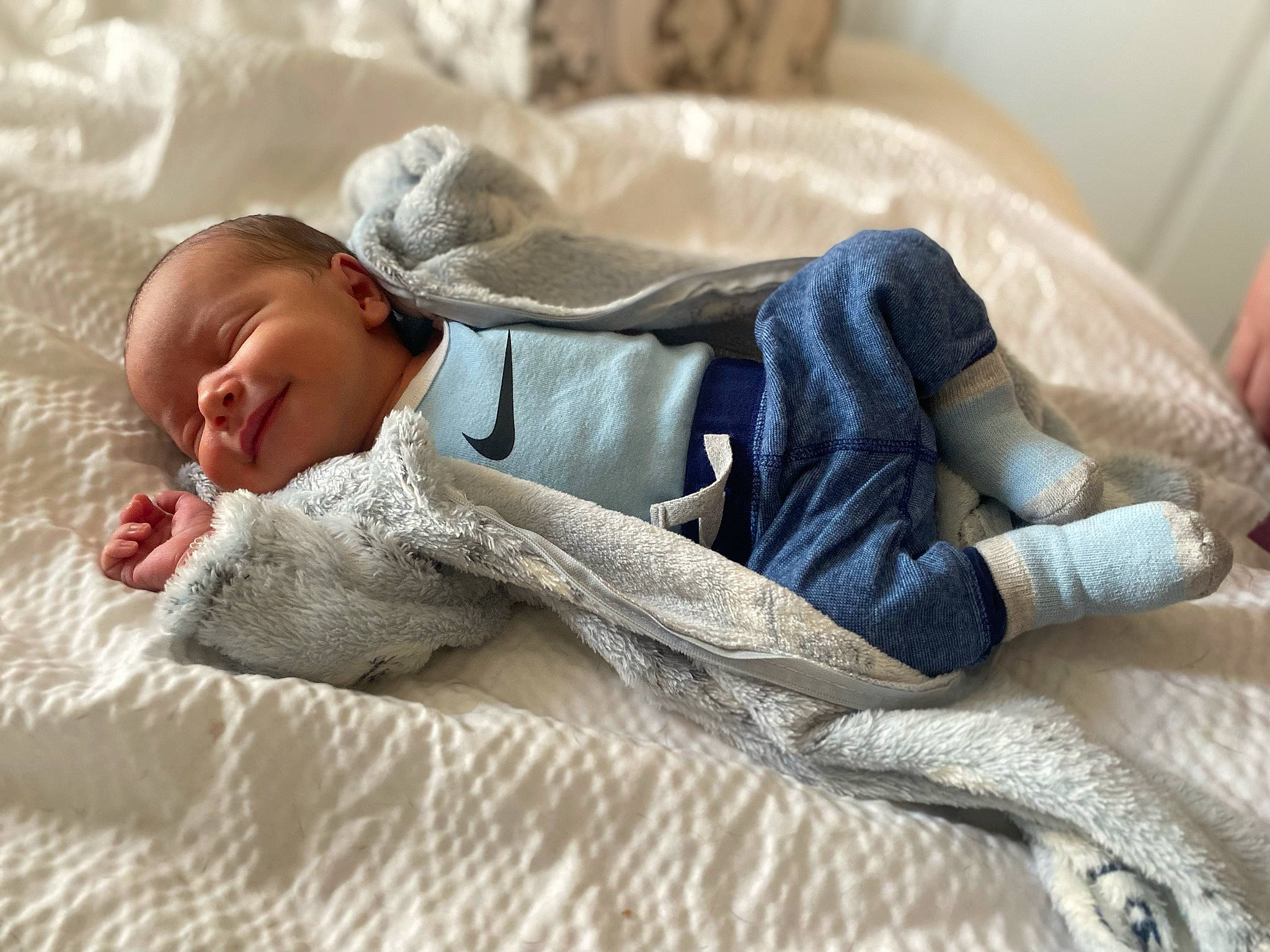 Hector is registered to the contest to win money with this photo: baby, baby_products, baby_sleeping, bed_sheet, bedding, bedtime, blanket, child, comfort, fur, grass, human_body, linens, nap, person, room, sitting, sleep, textile, toddler