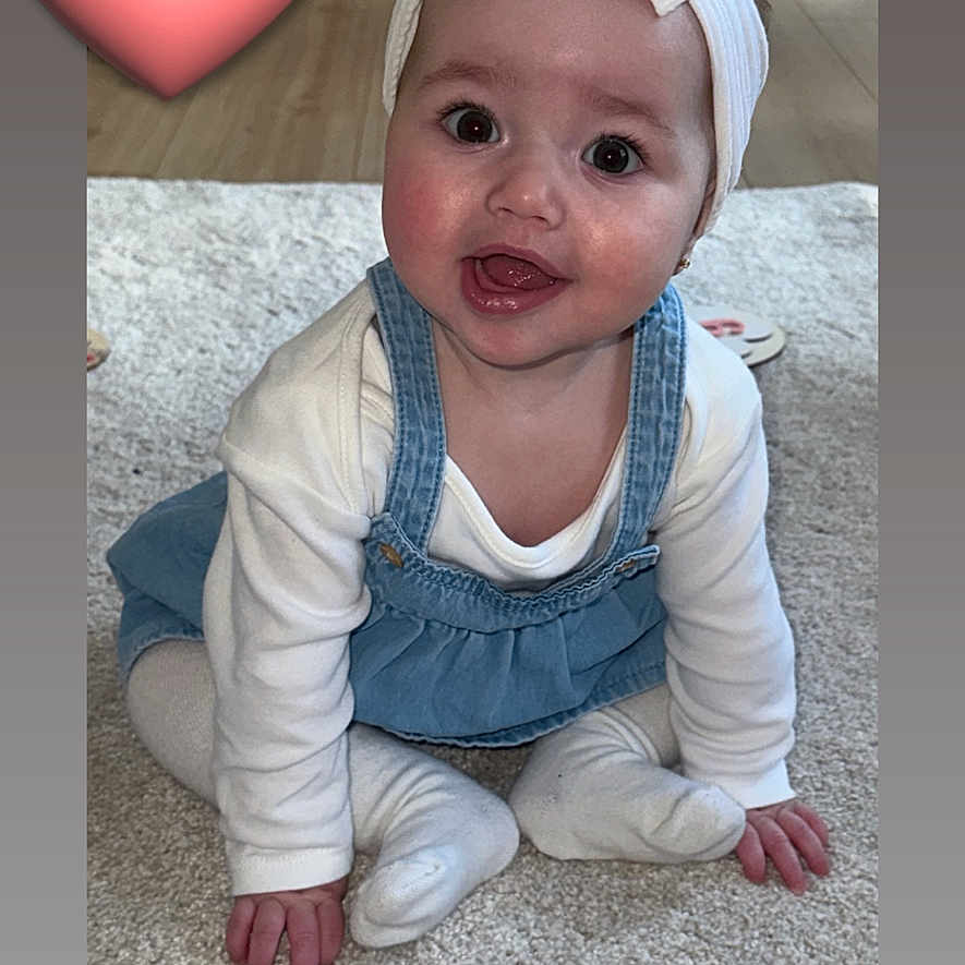 Darcy joined the competition — help win amazing prizes! baby, bow, carpet, child, cute, denim, dress, eyes, face, floor, hand, happy, headband, heart_emoji, indoor, person, sitting, smile, toddler, white_clothing
