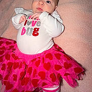 Alaiia joined the competition — help win amazing prizes! baby, big_eyes, child, close_up, clothing, cute, flash_photography, hands, heart_pattern, infant, lying_down, onesie, pink_blanket, pink_color, portrait, relaxed, socks, soft_texture, striped_tights, tutu