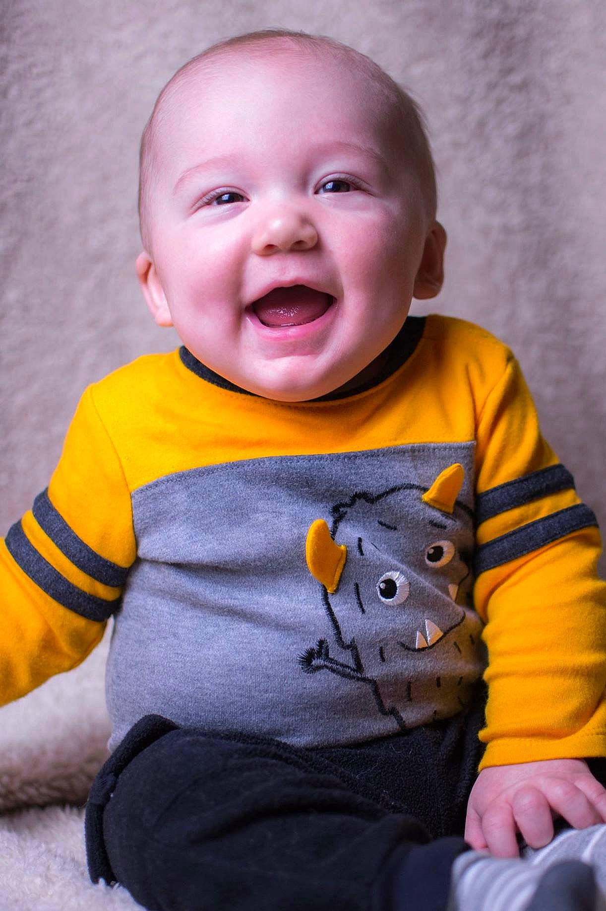 Ej Scruggs  joined the competition — help win amazing prizes! baby, baby_toddler_clothing, cheek, child, face, facial_expression, head, laugh, mouth, nose, person, sitting, skin, sleeve, smile, t_shirt, toddler, yellow