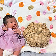 Cecilia joined the competition — help win amazing prizes! baby, infant, purple_dress, blanket, pumpkin_pattern, woven_pumpkin, cute, newborn, lying_down, soft_texture, autumn_theme, decor, cozy, indoor, small_hands, portrait, child, fabric, pattern, head