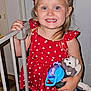 Charlotte is registered to the contest to win money with this photo: bodypart, child, clothing, crib, dress, face, female, finger, furniture, girl, hand, head, indoors, infantbed, pants, person, photography, portrait, shorts, toy