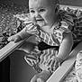 baby, bedspread, black_and_white, child, closeup, curly_hair, cute, expression, face, hand, happy, indoor, infant, mirror, person, portrait, reflection, smile, striped_clothing, texture