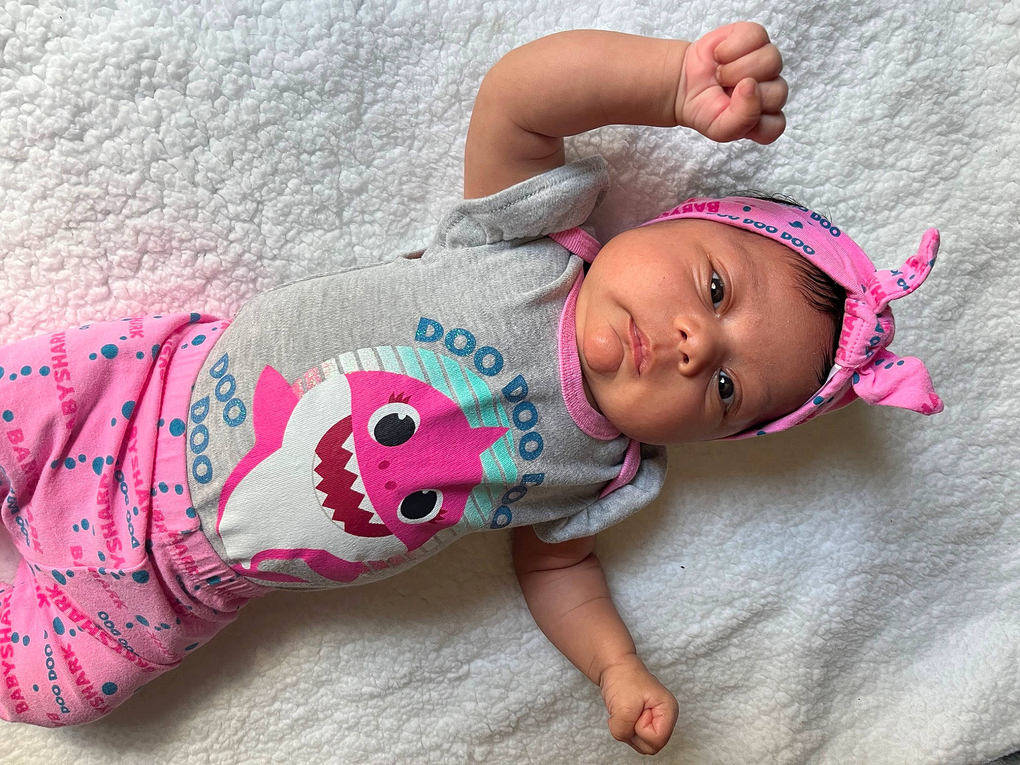 Azalea is registered to the contest to win money with this photo: arm, baby, baby_toddler_clothing, cheek, chest, child, cool, face, hair, hand, headwear, human_body, joint, leg, neck, person, pink, skin, sleeve, textile
