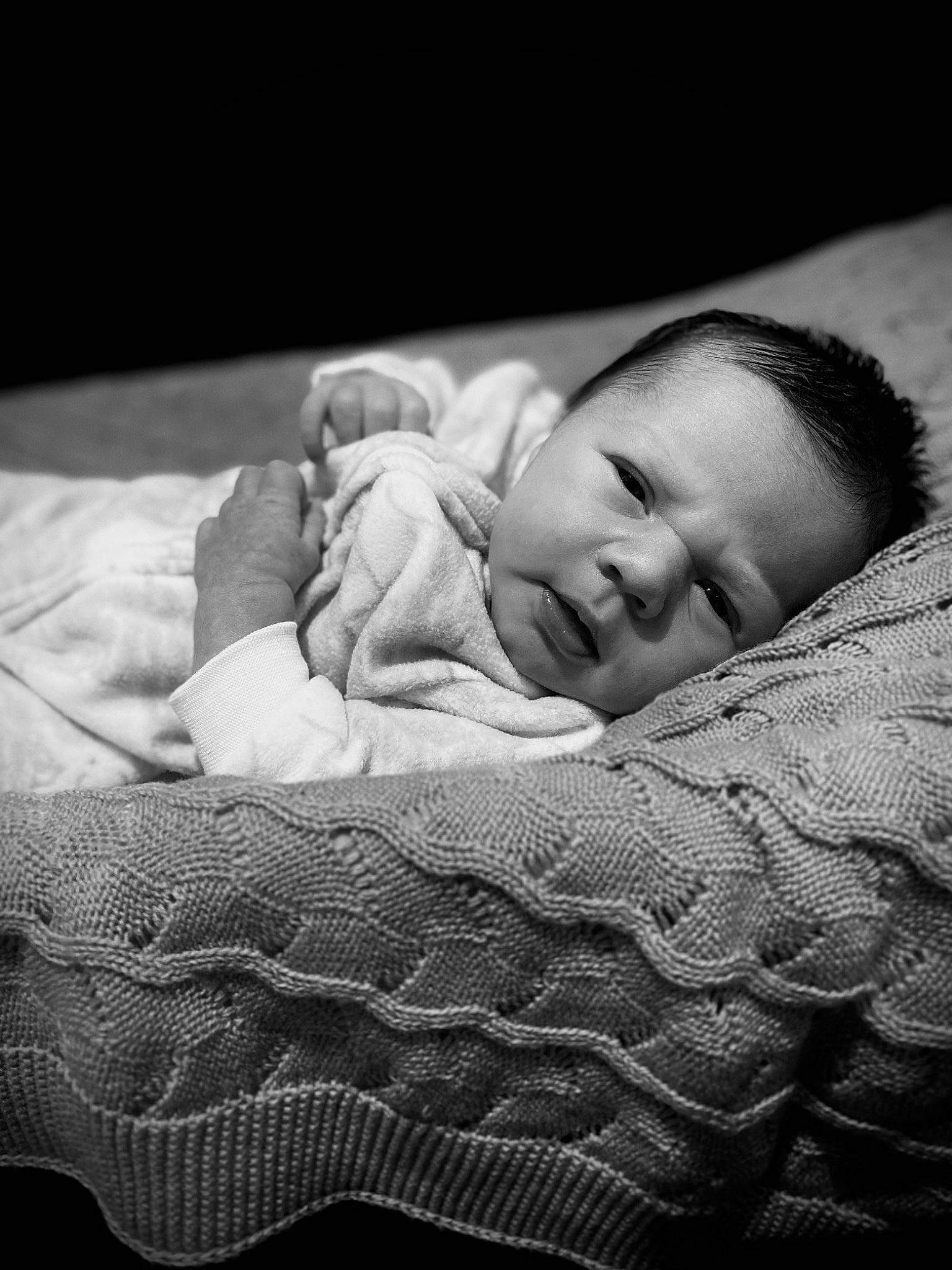 Braxley is registered to the contest to win money with this photo: baby, black_and_white, cheek, child, chin, comfort, eye, face, flash_photography, head, human_body, iris, mammal, mouth, nose, person, product, skin, toddler, vertebrate