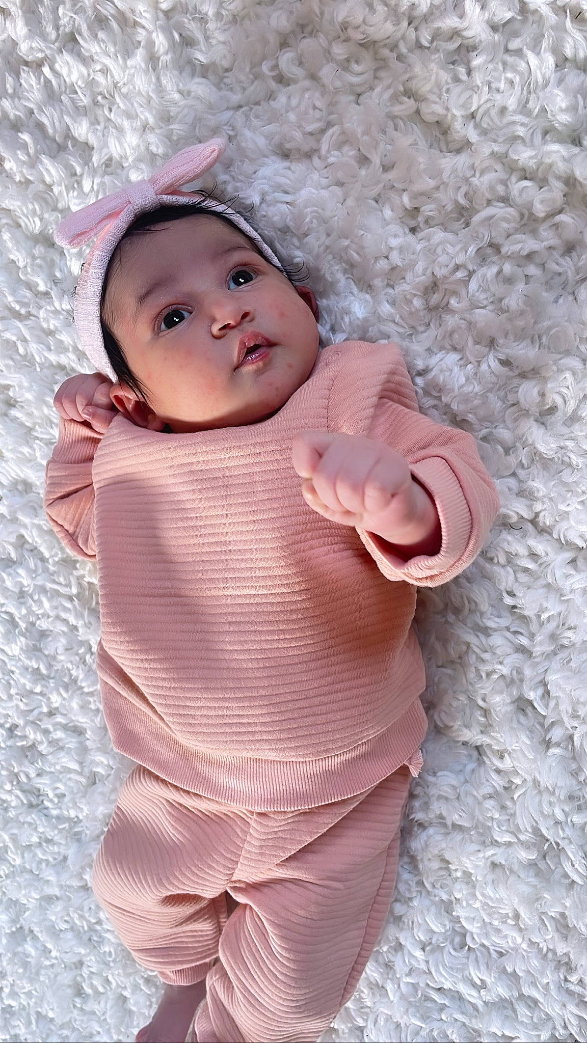 Alaiya is registered to the contest to win money with this photo: baby, baby_products, baby_toddler_clothing, cap, cheek, dress, eye, face, fashion_accessory, happy, headwear, lip, outerwear, pattern, person, pink, skin, sleeve, textile, toddler