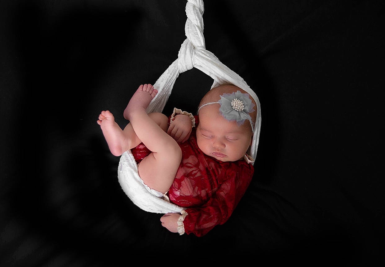 Paisley Rose is registered to the contest to win money with this photo: arm, baby, baby_products, baby_toddler_clothing, child, comfort, elbow, event, fashion_accessory, finger, flash_photography, fun, gesture, grass, hand, happy, headwear, leg, magenta, person