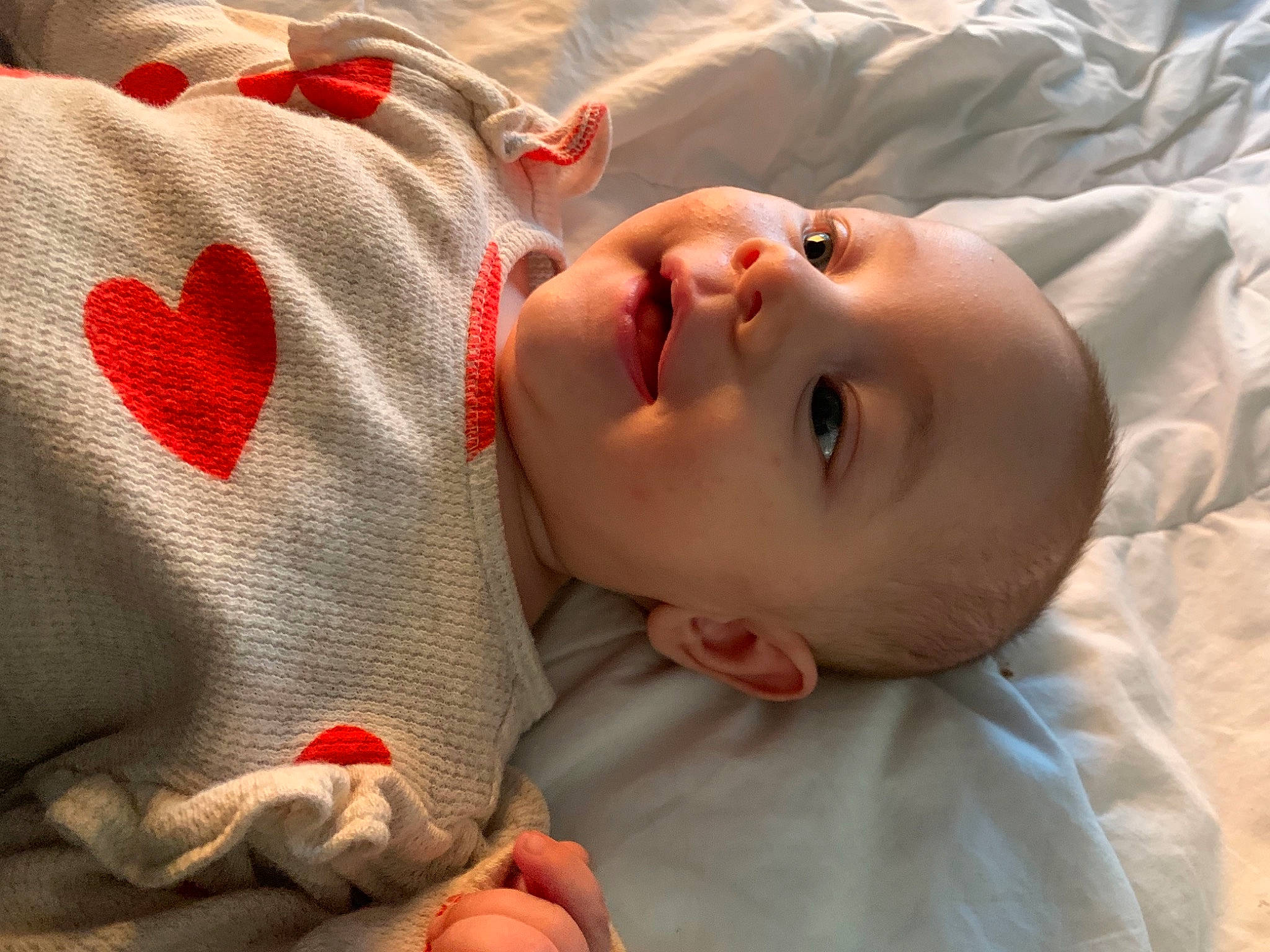 Malayah joined the competition — help win amazing prizes! baby, baby_toddler_clothing, carmine, cheek, child, chin, close_up, comfort, eye, face, head, linens, lip, mouth, nose, orange, pattern, person, skin, sleeve