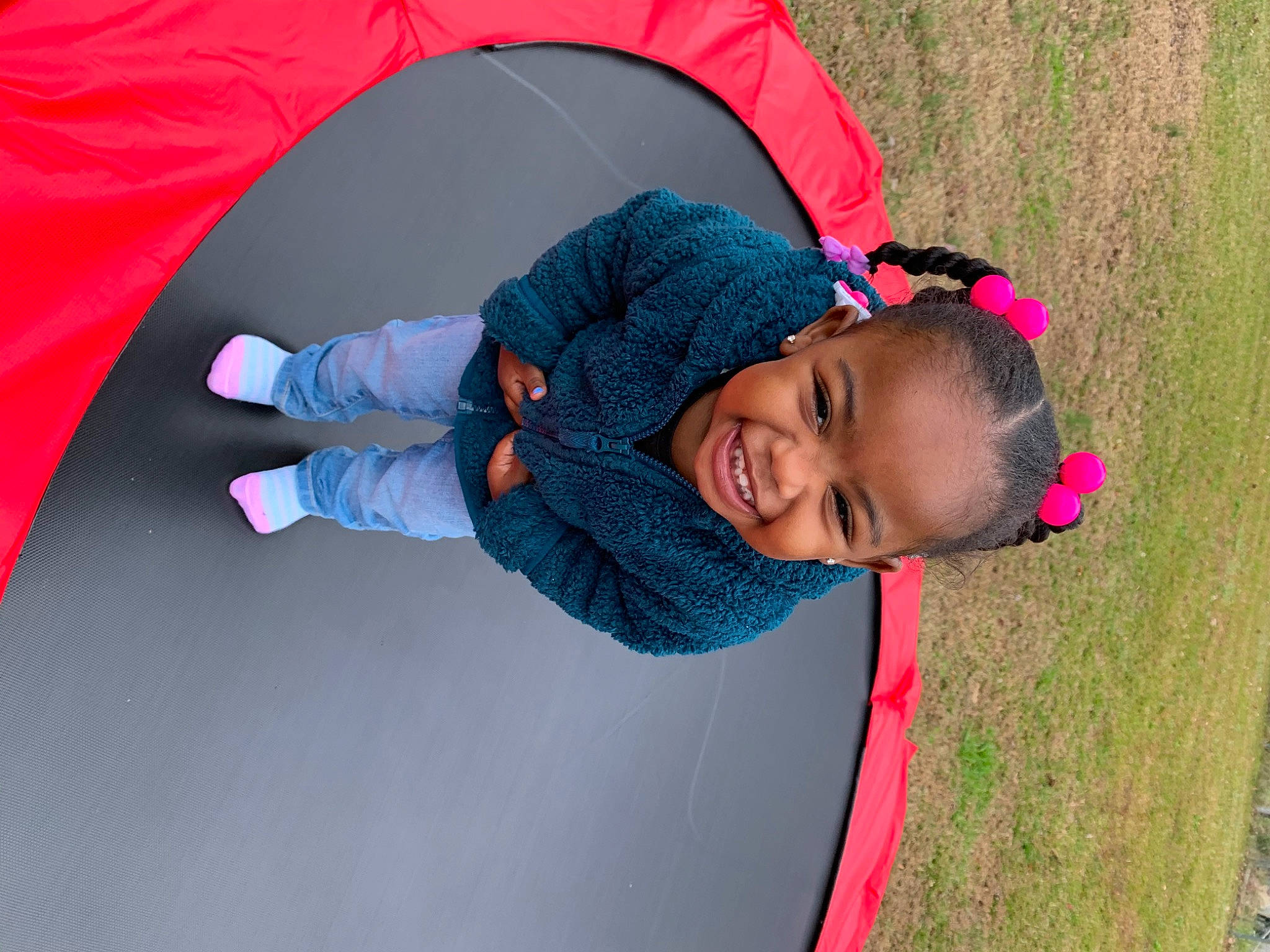 Melanie is registered to the contest to win money with this photo: child, electric_blue, eyewear, family_car, fun, grass, happy, joy, landscape, leisure, magenta, people_in_nature, person, pink, plant, play, recreation, red, smile, toddler