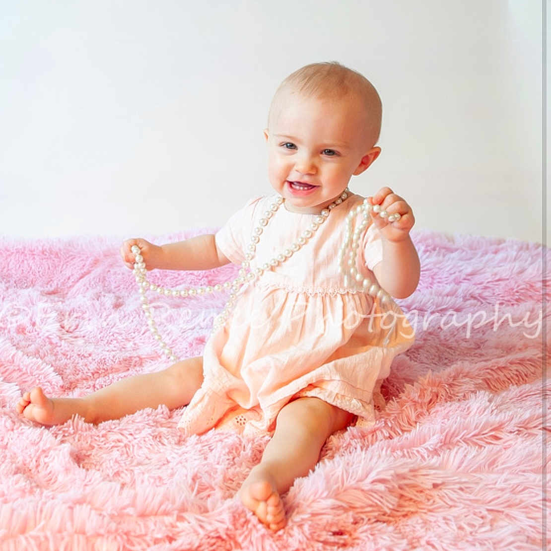 Valerie joined the competition — help win amazing prizes! accessories, baby, bodypart, clothing, dress, face, finger, hand, happy, head, homedecor, jewelry, necklace, newborn, pearl, person, photography, portrait, sitting, smile